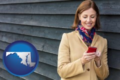 maryland map icon and middle-aged woman using a cell phone