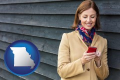missouri map icon and middle-aged woman using a cell phone